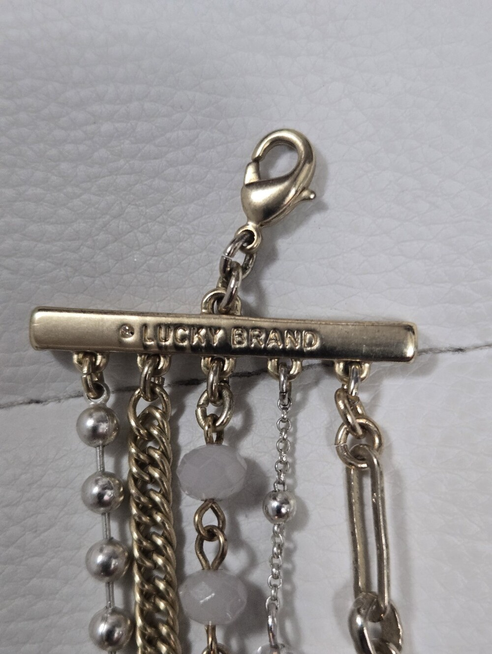 Lucky Brand Gold Multi-Row Bracelet with White Beads and Star Charms